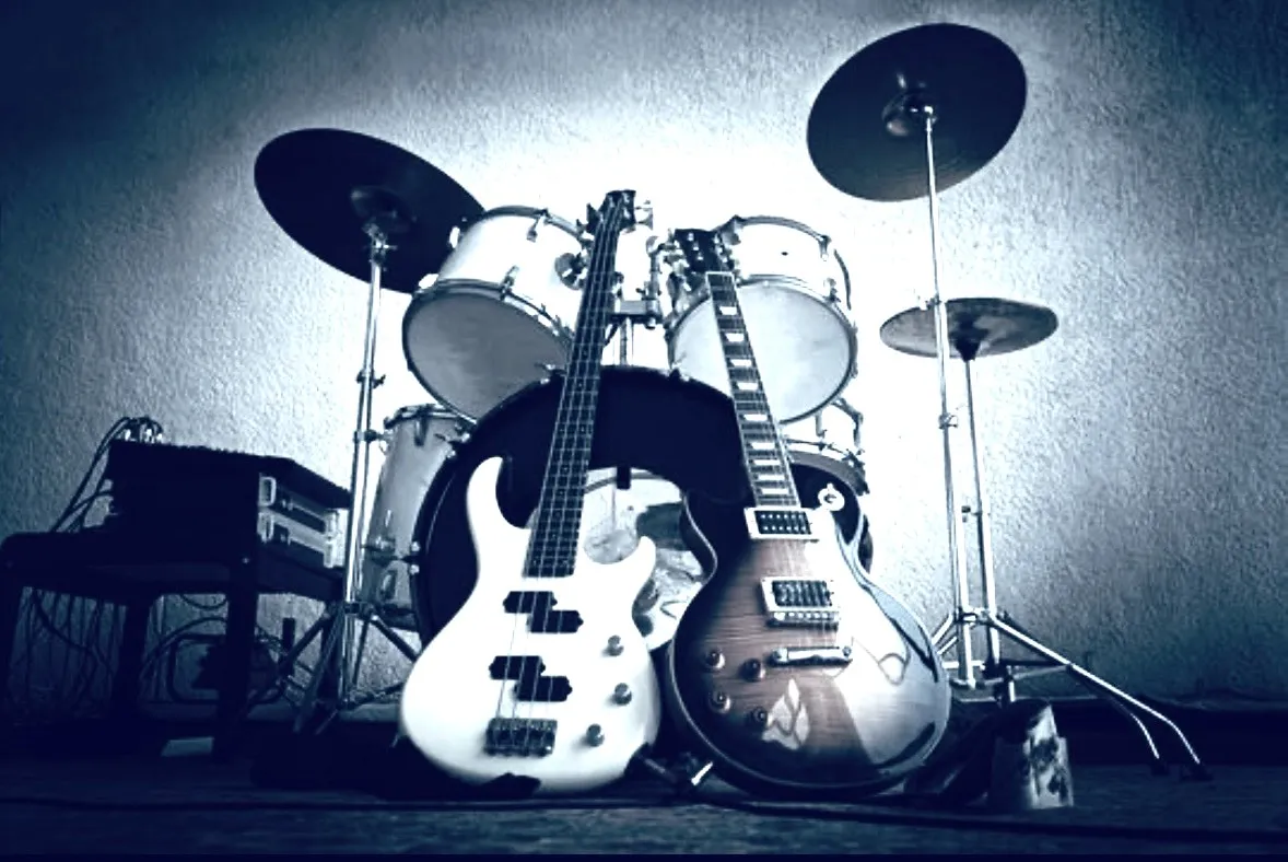Drums, a bass and an electric guitar set up together