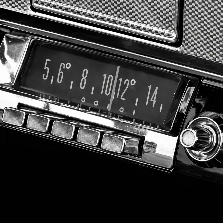 The dial and push buttons of an old car radio